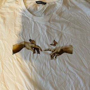 Hand and butterfly shirt